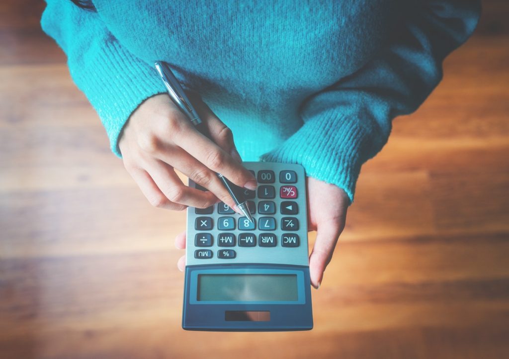 Woman using a calculator